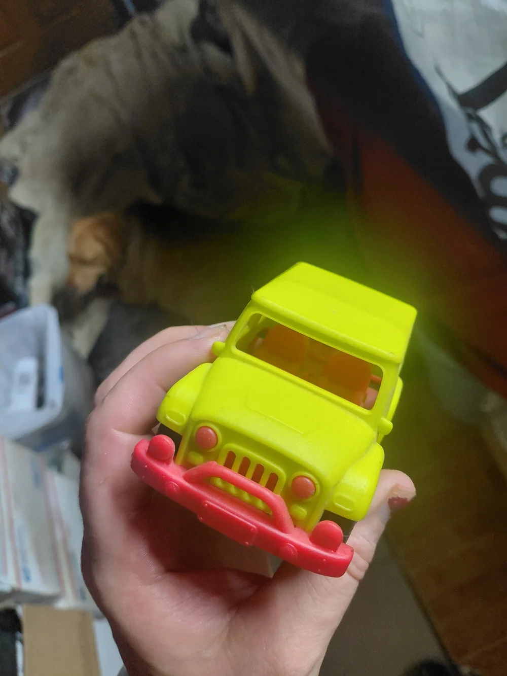 yellow toy vehicle is a B. toys Happy Cruisers Mini 4x4, featuring chunky wheels